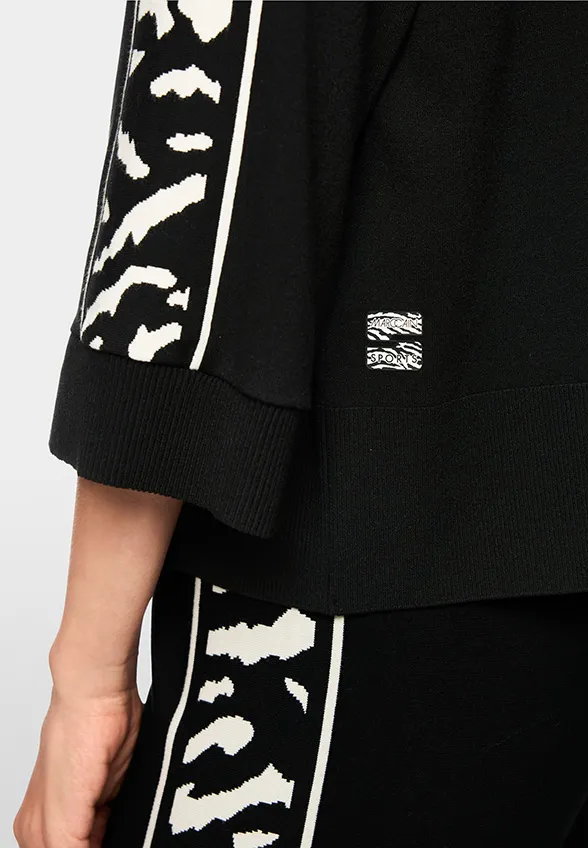 SWETER O LUŹNYM KROJU CZARNY